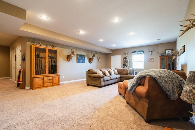 living room featuring carpet flooring, baseboards, and recessed lighting