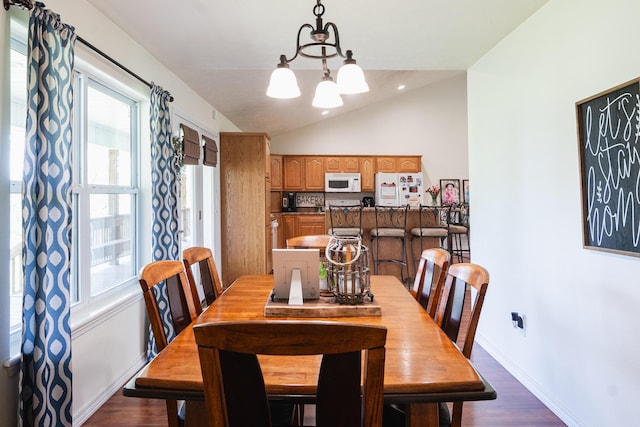 dining room featuring baseboards, a chandelier, plenty of natural light, dark wood-style floors, and lofted ceiling