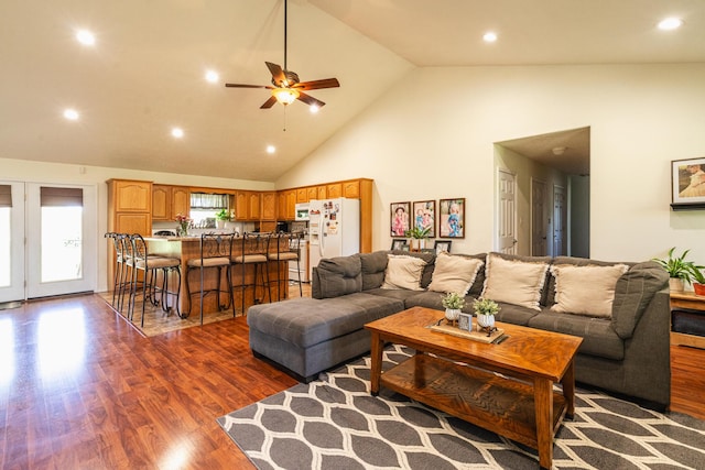 living area featuring recessed lighting, high vaulted ceiling, a ceiling fan, and wood finished floors