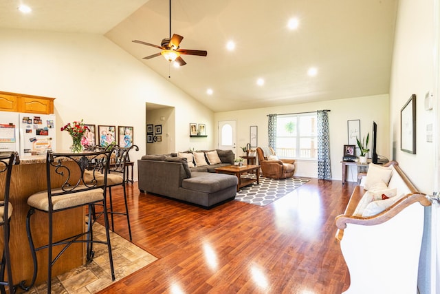 living room with a ceiling fan, high vaulted ceiling, dark wood finished floors, and recessed lighting