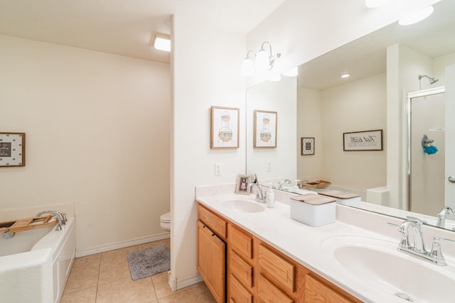 full bath with toilet, a stall shower, double vanity, and a sink