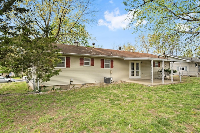 3144 N Pierce Ave, Springfield, MO 65803 - back of house with central AC, a yard, a patio area, fence, and french doors