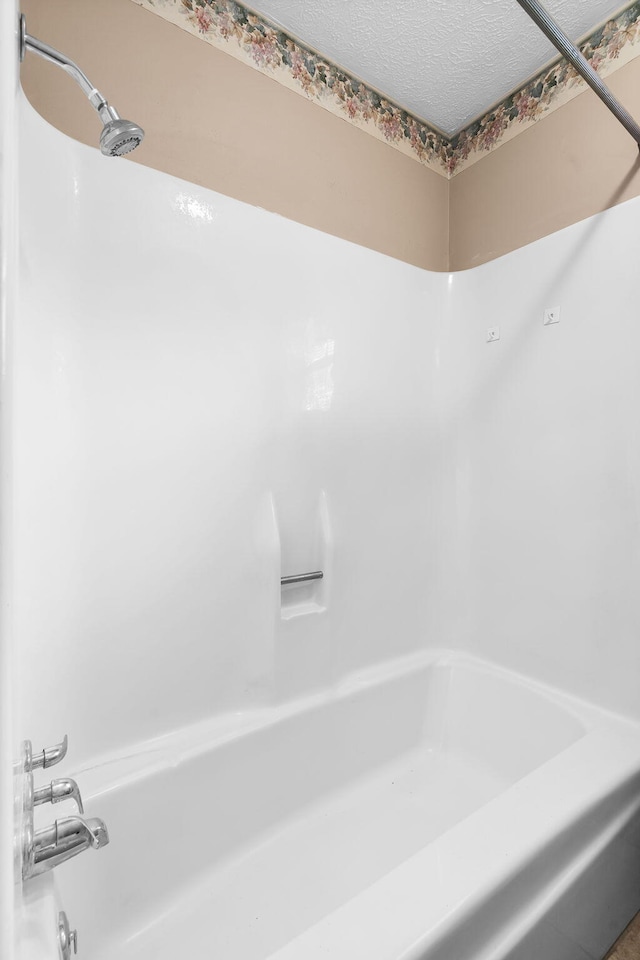 3144 N Pierce Ave, Springfield, MO 65803 - full bath featuring washtub / shower combination and a textured ceiling