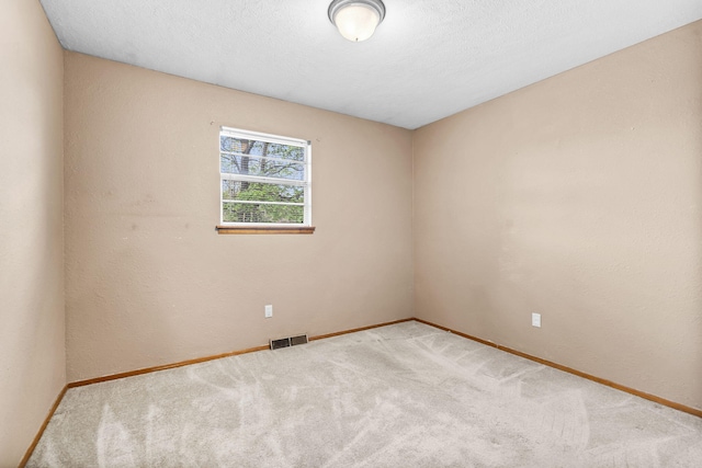 3144 N Pierce Ave, Springfield, MO 65803 - carpeted spare room with visible vents and baseboards