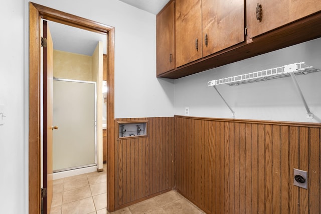 3144 N Pierce Ave, Springfield, MO 65803 - laundry room with light tile patterned floors, hookup for a washing machine, hookup for an electric dryer, wainscoting, and cabinet space