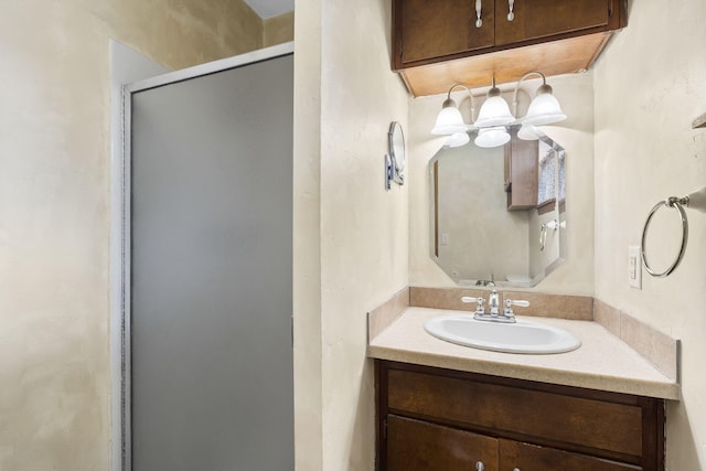 3144 N Pierce Ave, Springfield, MO 65803 - full bathroom with vanity, an inviting chandelier, and a stall shower