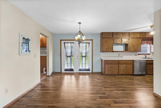 3144 N Pierce Ave, Springfield, MO 65803 - kitchen with baseboards, dark wood-style floors, light countertops, brown cabinetry, and dishwasher