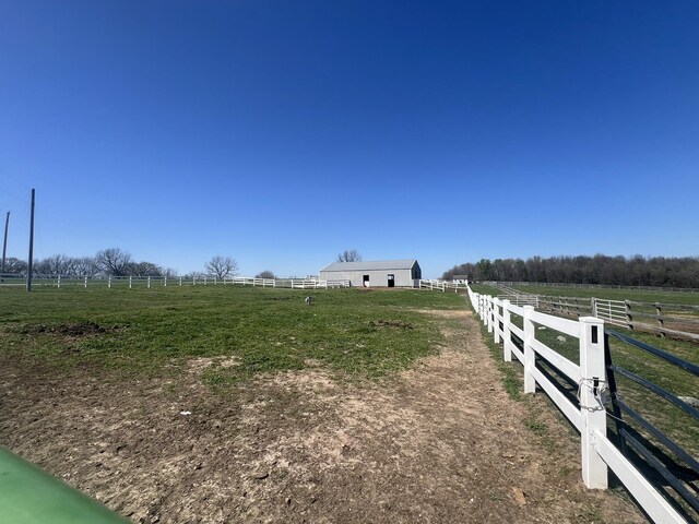 0 S 162nd Rd, Bolivar, MO 65613 - view of yard with a rural view, an outdoor structure, fence, and an outbuilding