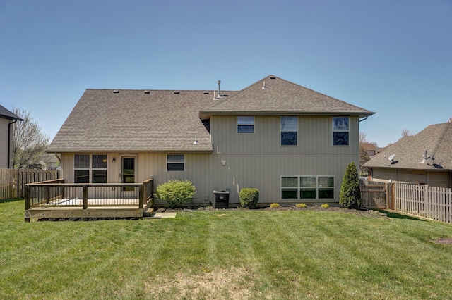 3684 Bridgewood Ave N, Springfield, MO 65803 - back of house with a wooden deck, a yard, roof with shingles, and a fenced backyard