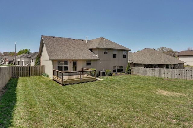 3684 Bridgewood Ave N, Springfield, MO 65803 - rear view of house with a wooden deck, a lawn, and a fenced backyard