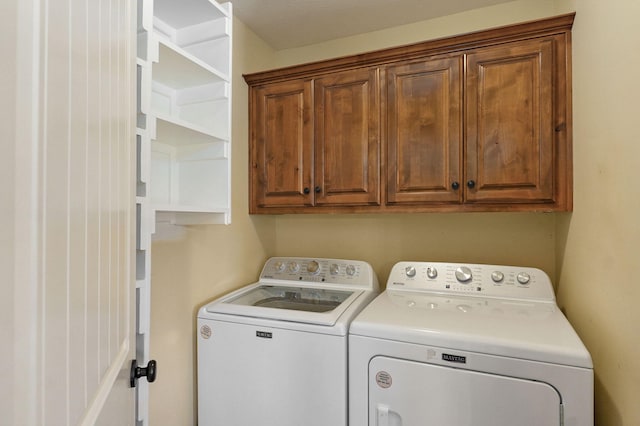 3684 Bridgewood Ave N, Springfield, MO 65803 - washroom featuring cabinet space and washing machine and clothes dryer