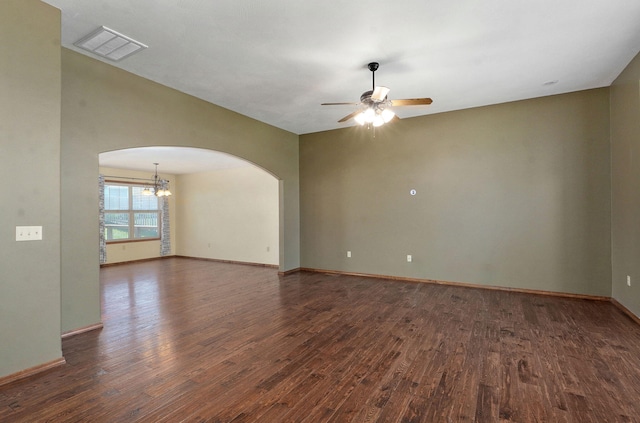 3684 Bridgewood Ave N, Springfield, MO 65803 - empty room with arched walkways, dark wood-style flooring, baseboards, visible vents, and ceiling fan with notable chandelier