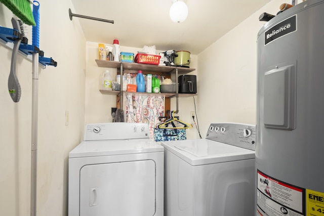 washroom with electric water heater, independent washer and dryer, and laundry area
