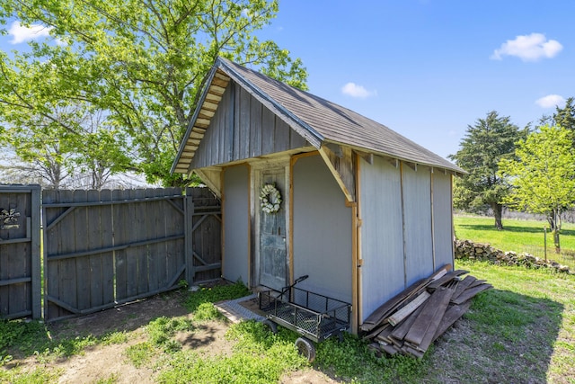 view of shed with fence