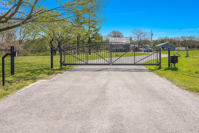 gate featuring a lawn