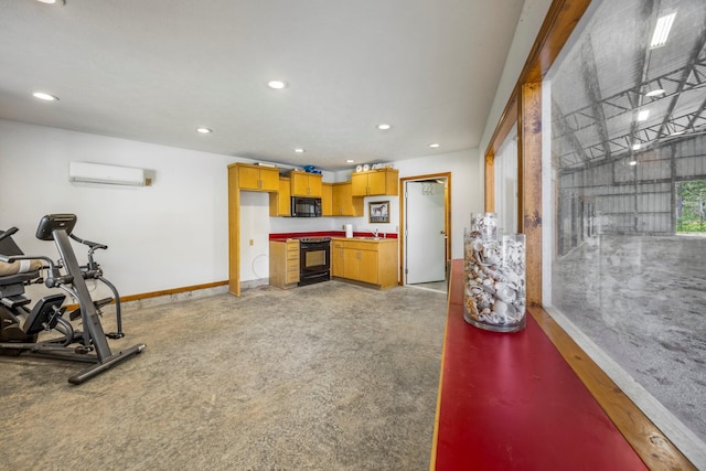 exercise area featuring a wall unit AC, baseboards, and recessed lighting