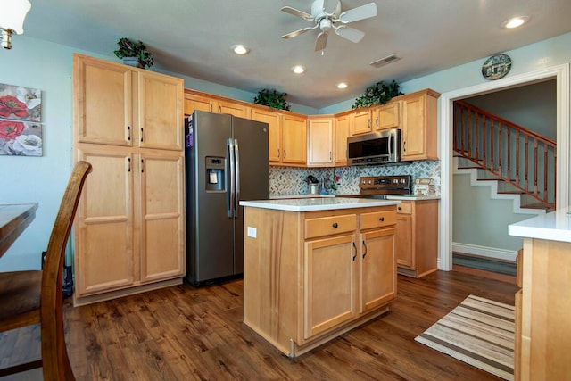 707 E Mining Camp Rd, Nixa, MO 65714 - kitchen with ceiling fan, appliances with stainless steel finishes, dark wood-style flooring, light countertops, and light brown cabinets