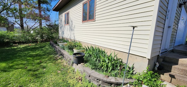 view of home's exterior featuring a yard