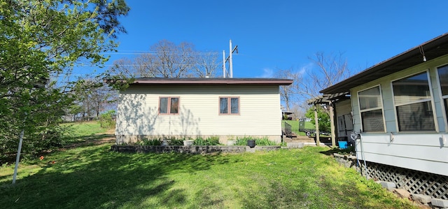 view of home's exterior with a yard
