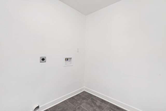 341 N Golden Ave, Springfield, MO 65802 - washroom with baseboards, laundry area, dark tile patterned flooring, electric dryer hookup, and hookup for a washing machine