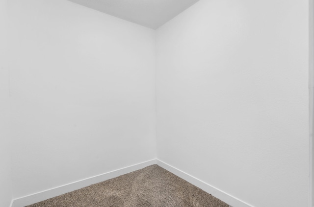 341 N Golden Ave, Springfield, MO 65802 - empty room with baseboards and dark carpet