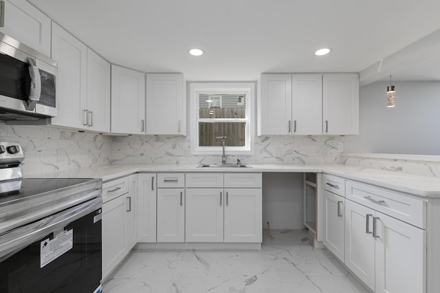 2120 N Broadway Ave, Springfield, MO 65803 - kitchen featuring appliances with stainless steel finishes, a sink, backsplash, and white cabinets