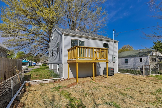 2120 N Broadway Ave, Springfield, MO 65803 - rear view of house featuring a deck, a fenced backyard, and central AC unit