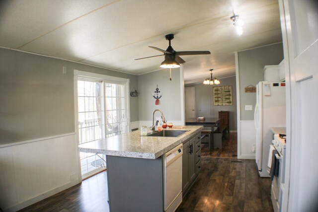 27321 County Rd 209, Flemington, MO 65650 - kitchen featuring dark wood-type flooring, a sink, white appliances, and a wainscoted wall