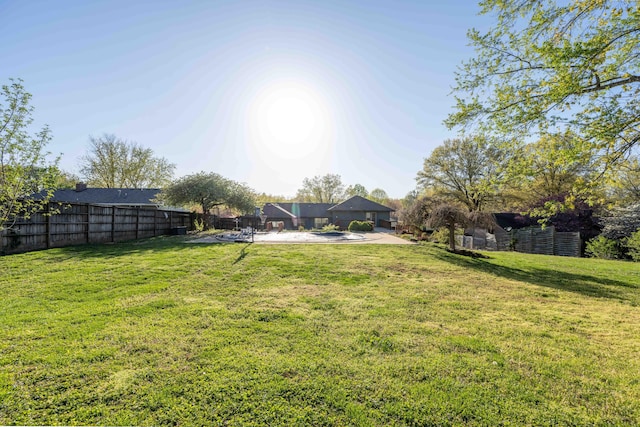 view of yard with fence and a patio area