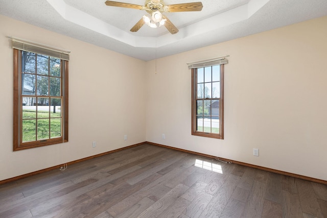 170 Oakridge Ave, Branson, MO 65616 - empty room with baseboards, wood finished floors, a raised ceiling, and ceiling fan