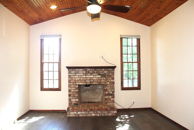 170 Oakridge Ave, Branson, MO 65616 - unfurnished living room with vaulted ceiling, ceiling fan, baseboards, a brick fireplace, and wood-type flooring