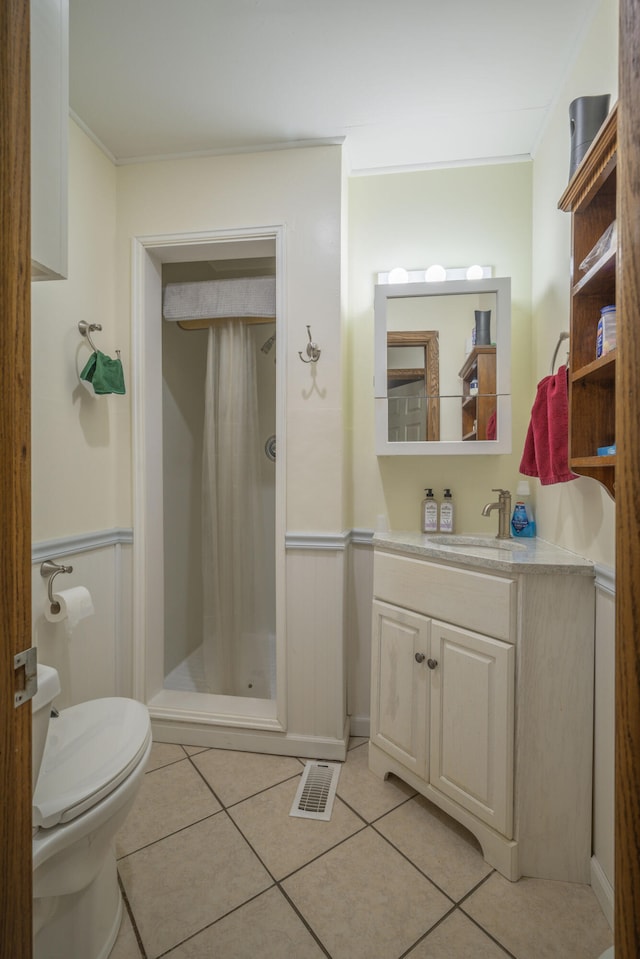 940 Industrial Dr, Neosho, MO 64850 - bathroom with vanity, a shower stall, toilet, tile patterned floors, and crown molding