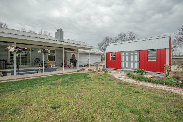 940 Industrial Dr, Neosho, MO 64850 - view of grassy yard with an outbuilding and a patio