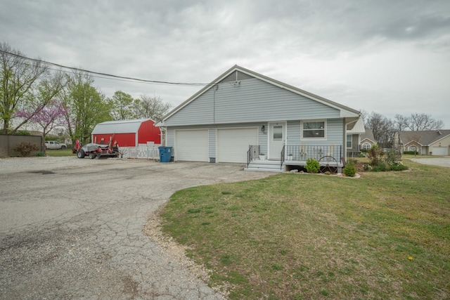 940 Industrial Dr, Neosho, MO 64850 - view of front facade featuring a front lawn, asphalt driveway, and covered porch