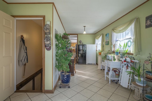 940 Industrial Dr, Neosho, MO 64850 - foyer with light tile patterned floors and ornamental molding
