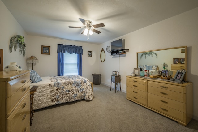 940 Industrial Dr, Neosho, MO 64850 - bedroom featuring light carpet, ceiling fan, and baseboards