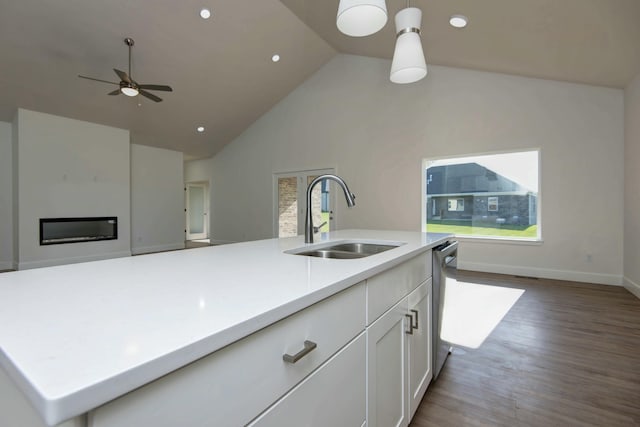 5896 Applewood Ave, Springfield, MO 65810 - kitchen with light countertops, a sink, white cabinetry, ceiling fan, and dishwasher