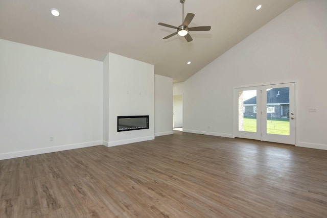 5896 Applewood Ave, Springfield, MO 65810 - unfurnished living room with high vaulted ceiling, a ceiling fan, wood finished floors, a glass covered fireplace, and baseboards