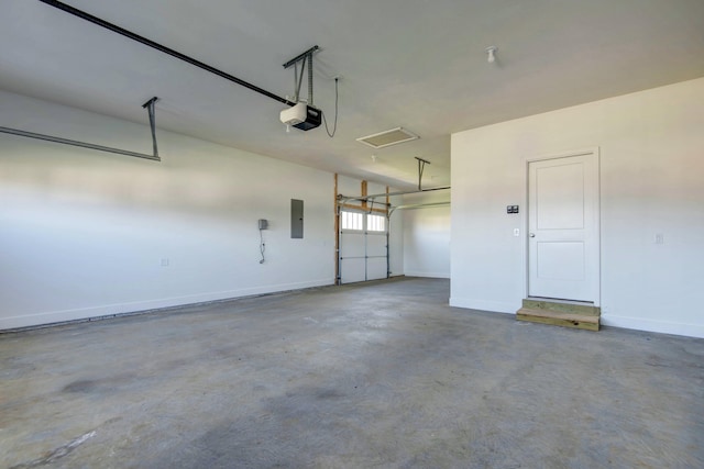5896 Applewood Ave, Springfield, MO 65810 - garage featuring electric panel, baseboards, and a garage door opener