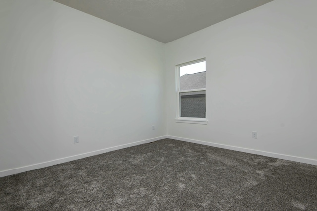 5896 Applewood Ave, Springfield, MO 65810 - spare room with baseboards and dark carpet