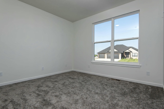 5896 Applewood Ave, Springfield, MO 65810 - empty room featuring dark carpet, visible vents, and baseboards