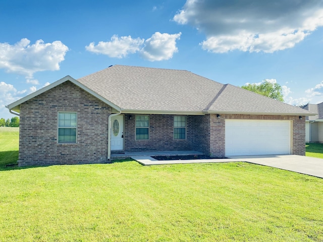 415 Brandermill Rd, Monett, MO 65708 - view of front of house with an attached garage, driveway, brick siding, and a front yard