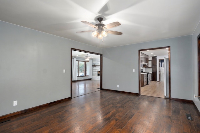 704 King St, Mount Vernon, MO 65712 - empty room with baseboards, visible vents, a ceiling fan, and dark wood-style floors