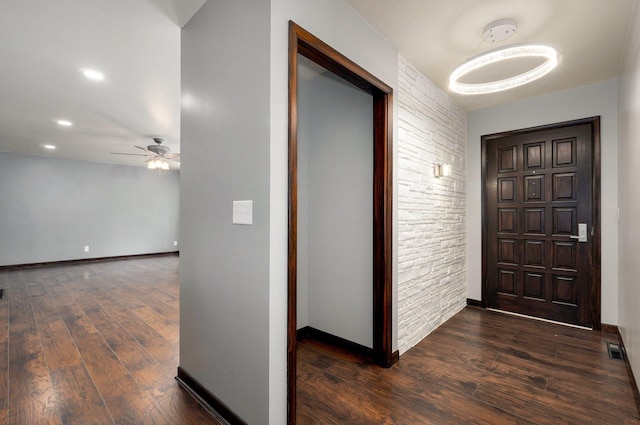 704 King St, Mount Vernon, MO 65712 - foyer entrance featuring baseboards, visible vents, dark wood-type flooring, and ceiling fan
