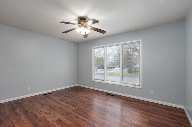 704 King St, Mount Vernon, MO 65712 - empty room featuring baseboards, visible vents, ceiling fan, and dark wood-style flooring