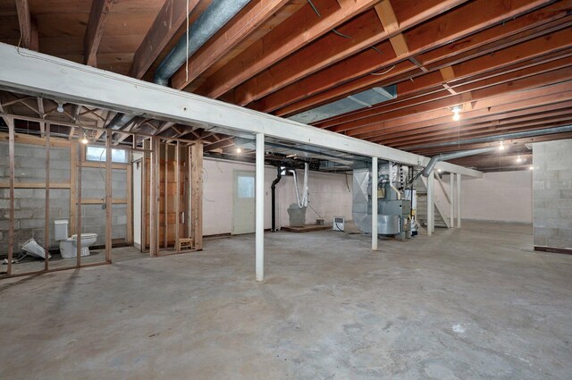 704 King St, Mount Vernon, MO 65712 - basement featuring heating unit and stairway