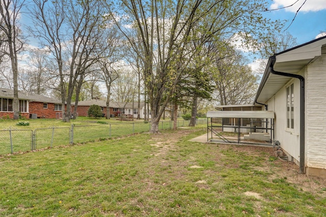 704 King St, Mount Vernon, MO 65712 - view of yard featuring a sunroom and a fenced backyard