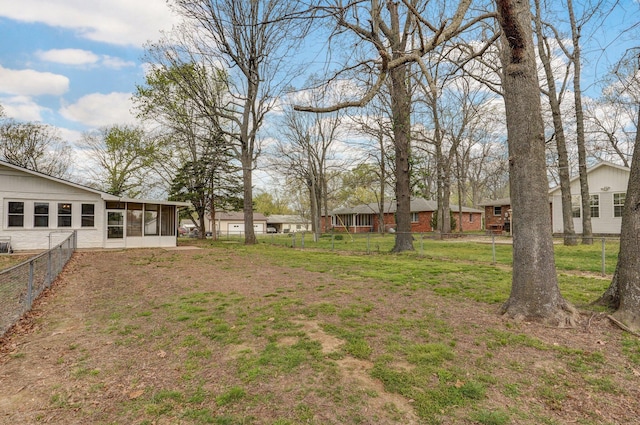 704 King St, Mount Vernon, MO 65712 - view of yard with a sunroom and a fenced backyard