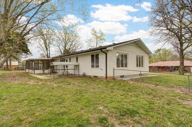 704 King St, Mount Vernon, MO 65712 - back of property featuring fence, crawl space, a sunroom, and a yard