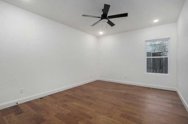 empty room featuring ceiling fan, baseboards, dark wood-type flooring, visible vents, and recessed lighting